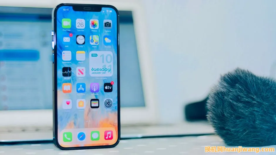 Smartphone displaying apps, notifications and time close-up indoors.