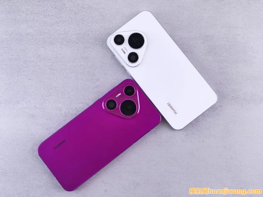 Two Huawei smartphones, one white and one purple, on a textured concrete surface.