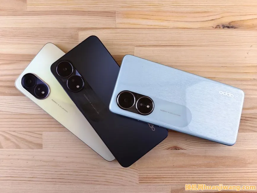 Three modern smartphones displayed on a wooden surface, showcasing design and color variants.