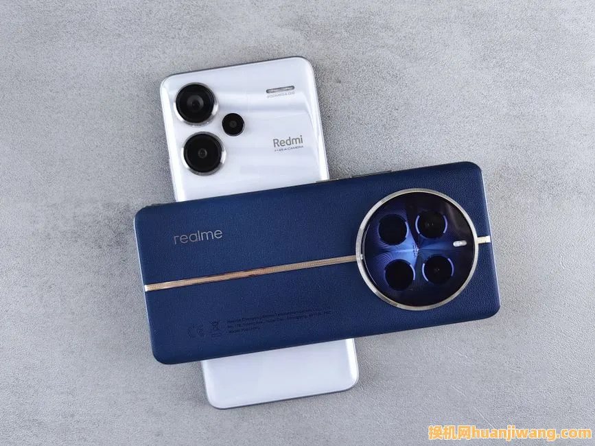 Flat lay of two modern smartphones with prominent camera designs on a concrete surface.